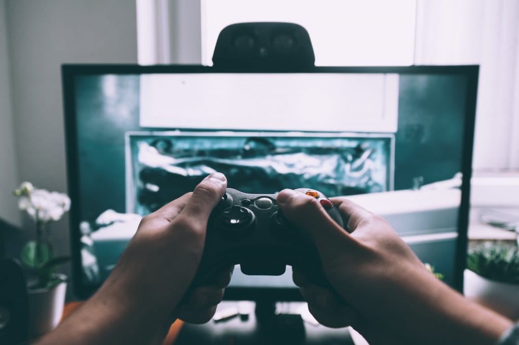 Teen gaming to improve language skills.